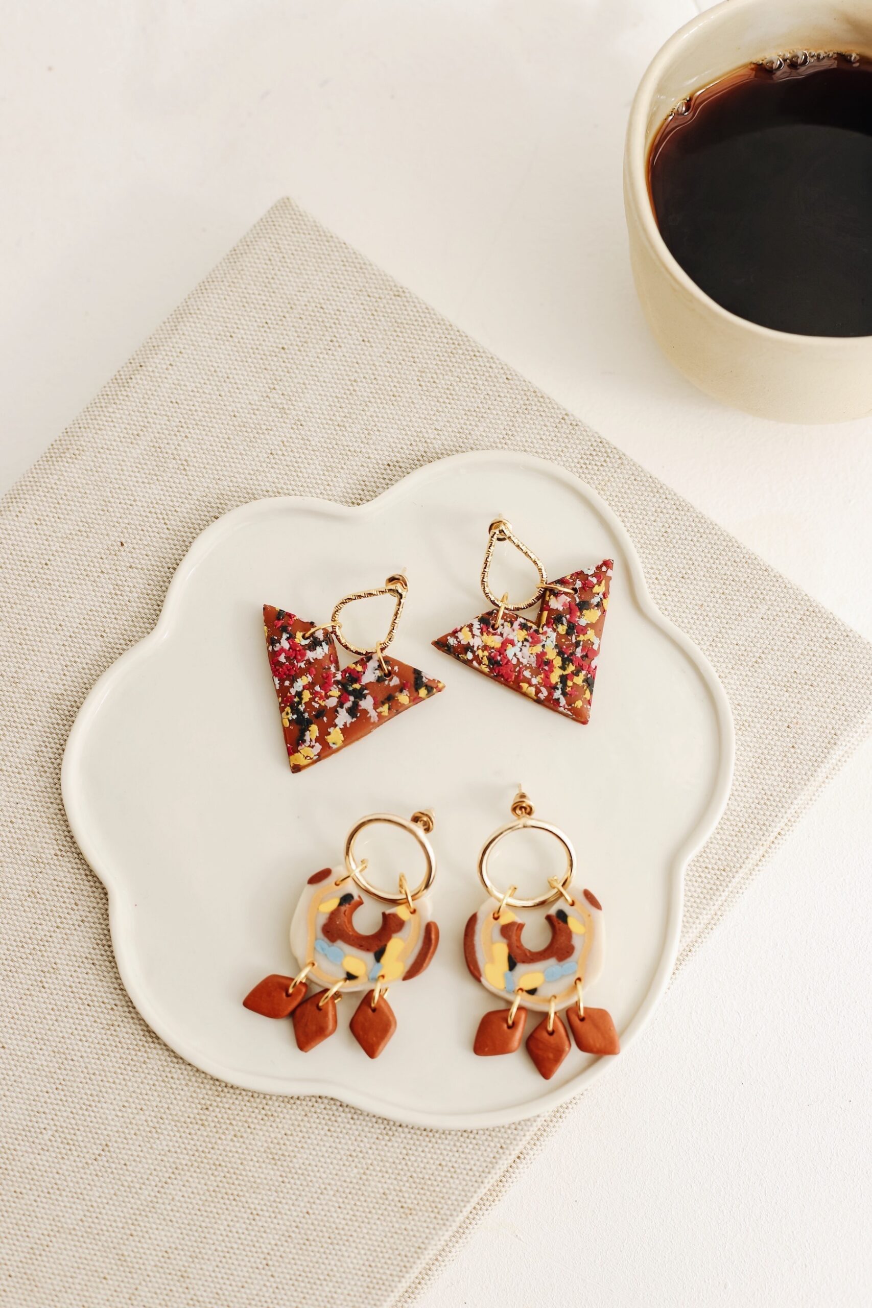 Rose is an earring was designed by a handmade woman designer. It was made of clay.