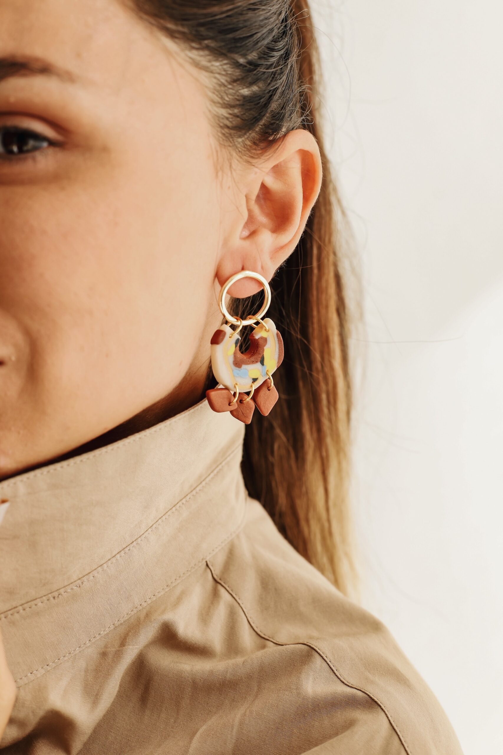 Carmen is an earring was designed by a handmade woman designer. It was made of clay