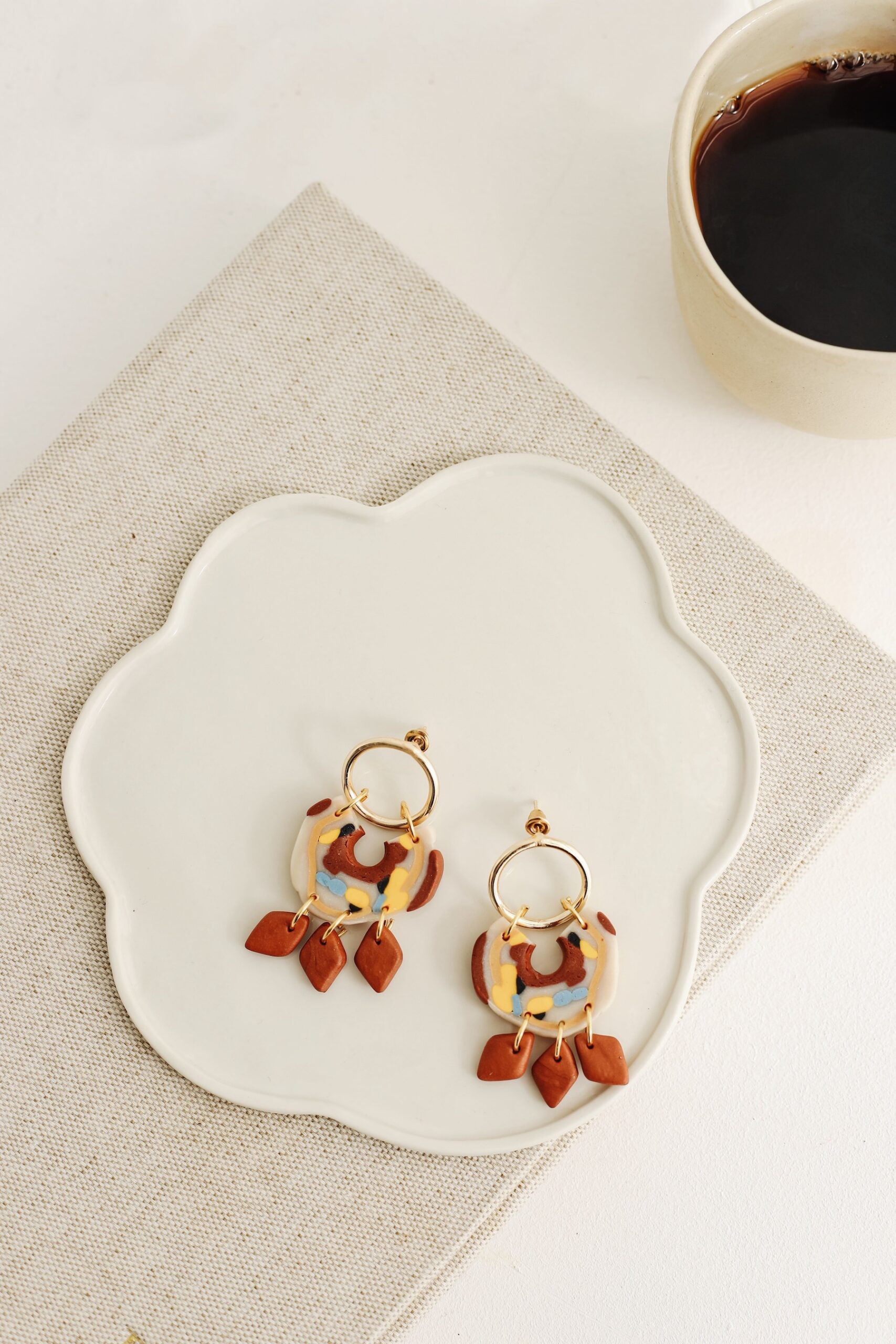 Carmen is an earring was designed by a handmade woman designer. It was made of clay