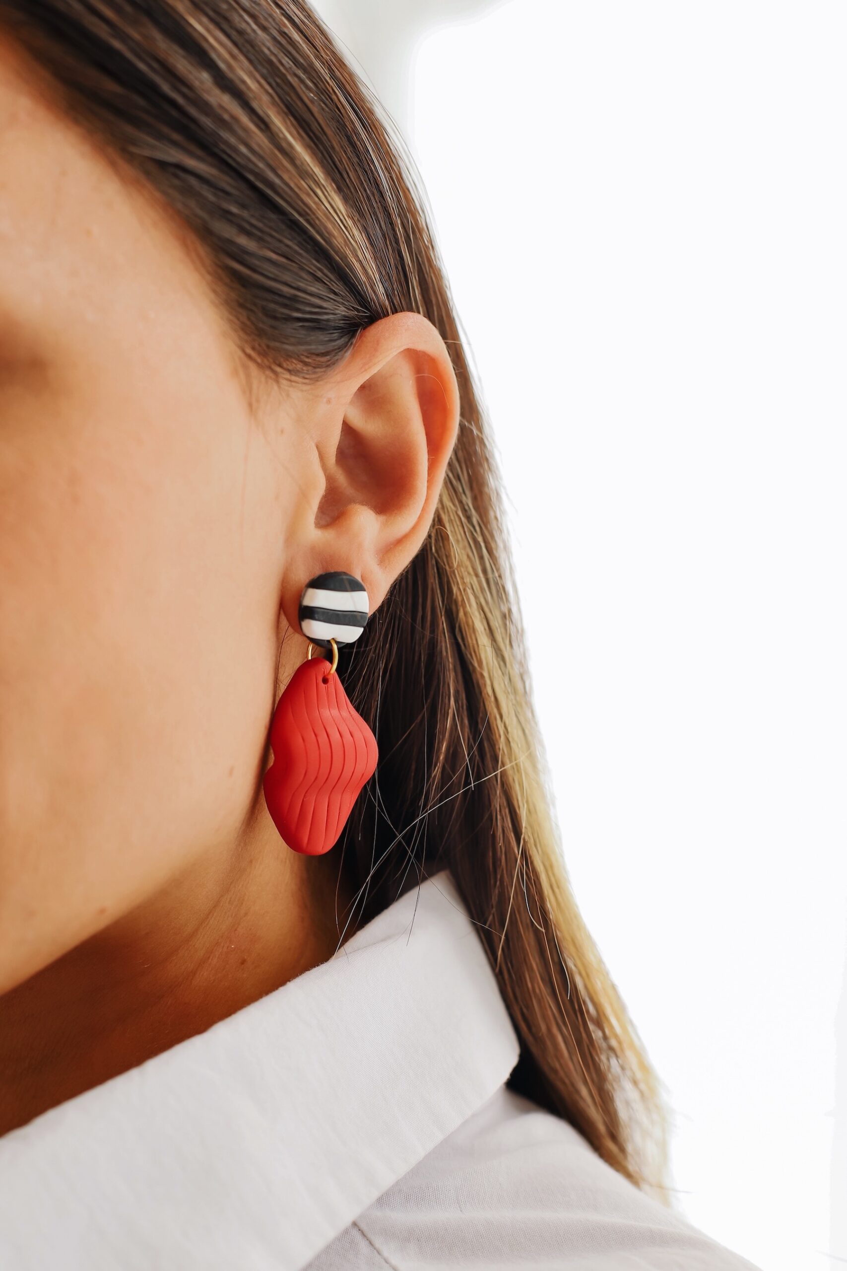 Margaret is an earring was designed by a handmade woman designer. It was made of clay